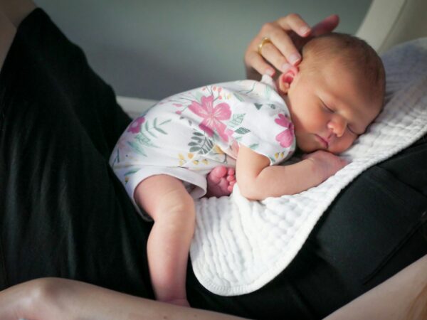 Ai taking over jobs? Sleeping baby on person's chest